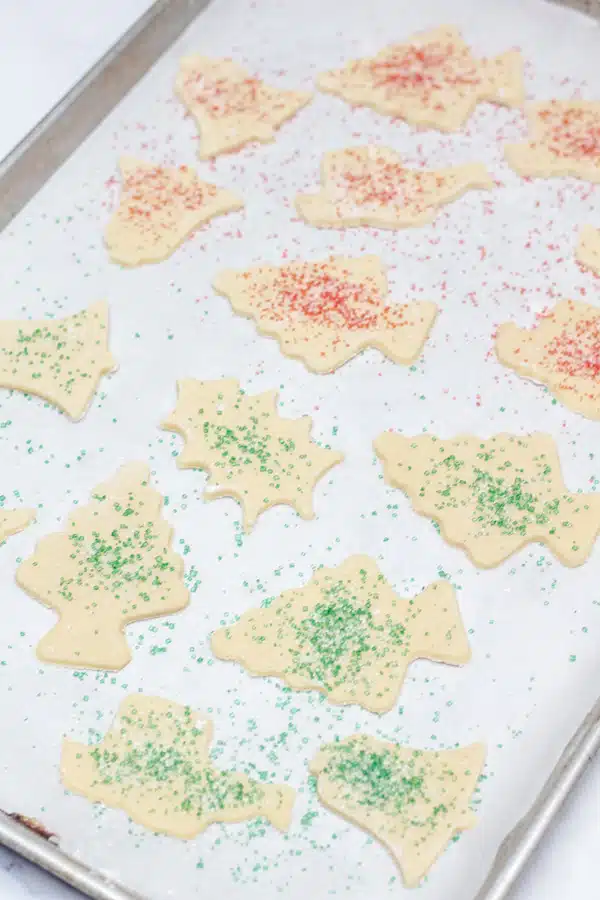 Powdered sugar cookies process photo 9 holiday sugar crystals sprinkled on the cookies in red and green colors.