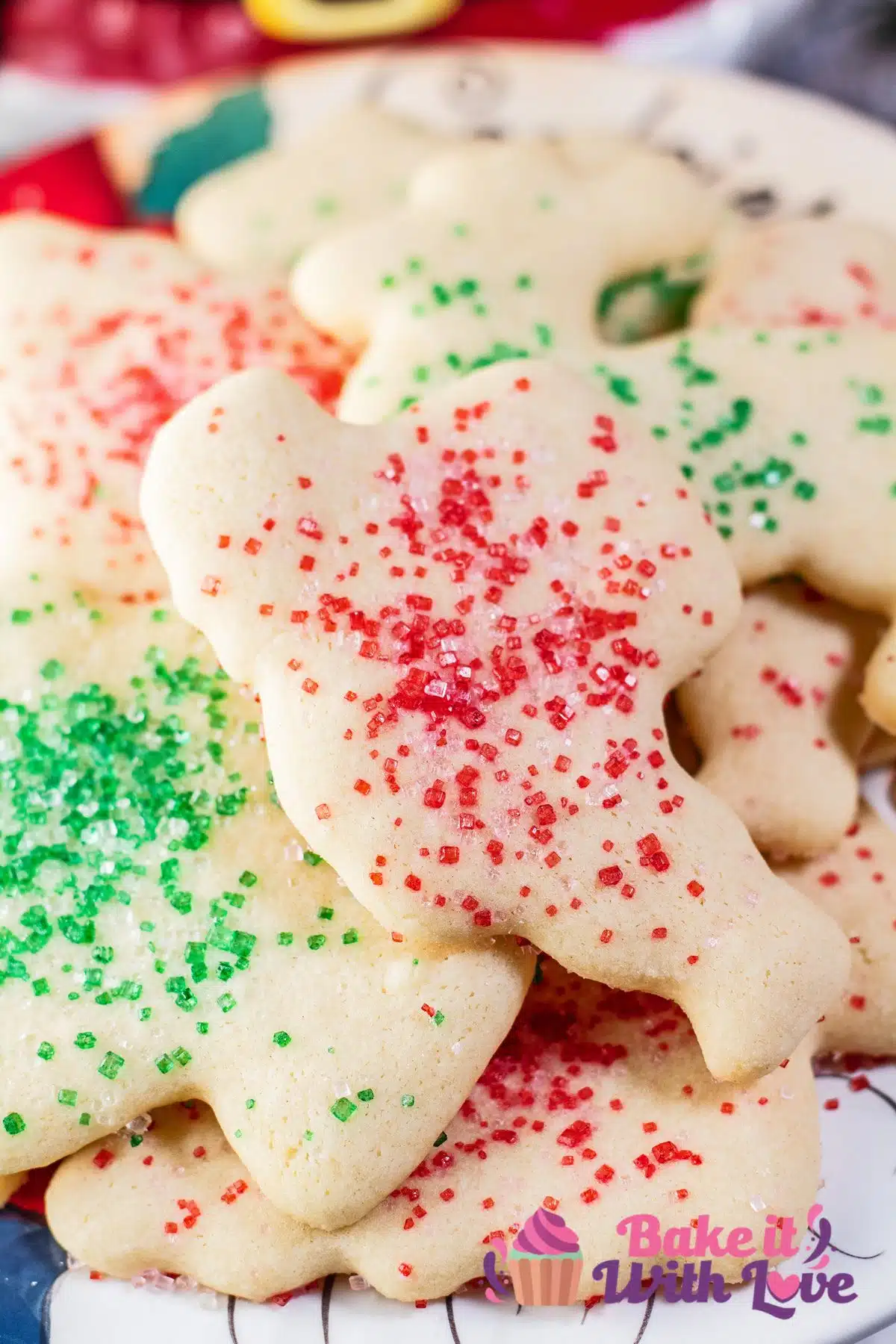 Best powdered sugar cookies to bake for any occasion like these Christmas cookies stacked on a festive plate.