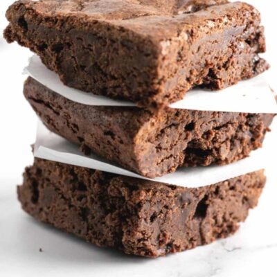 Tall image showing a plate of fudge brownies.