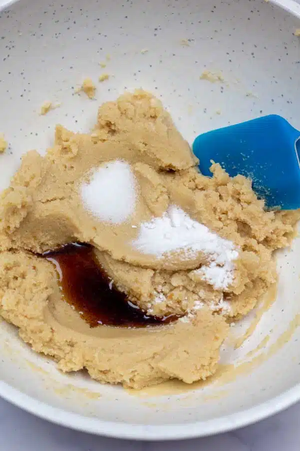 Process image 3 showing added vanilla and baking soda.