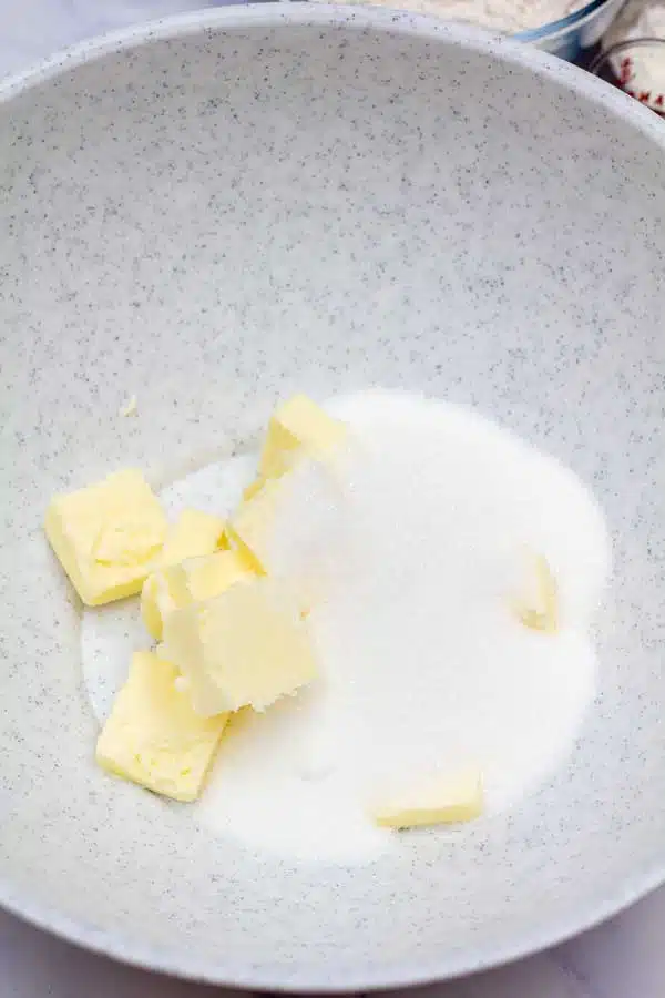 Process image 1 showing butter and sugar in a mixing bowl.