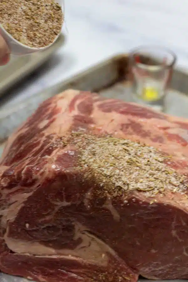 Process image 3 showing applying rub to prime rib roast.