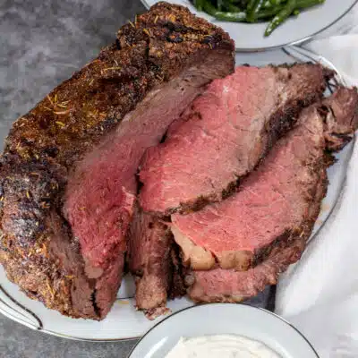 Square image of a sliced grilled prime rib.