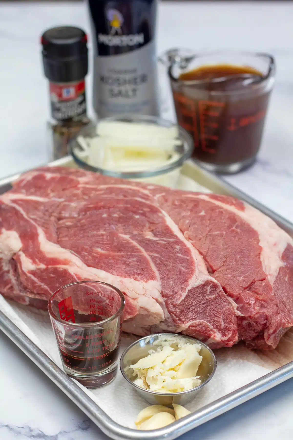 Tall image showing instant pot chuck roast ingredients.