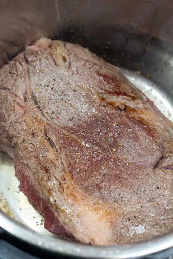 Process image 3 showing chuck roast searing in instant pot.