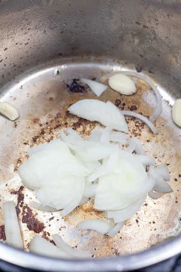 Process image 5 showing onions in instant pot.