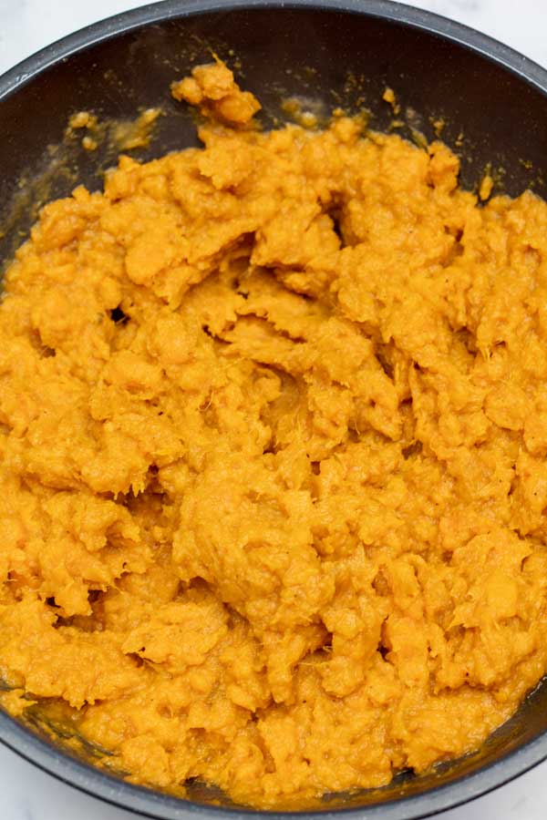 Process image 6 showing mashed sweet potatoes in a mixing bowl.
