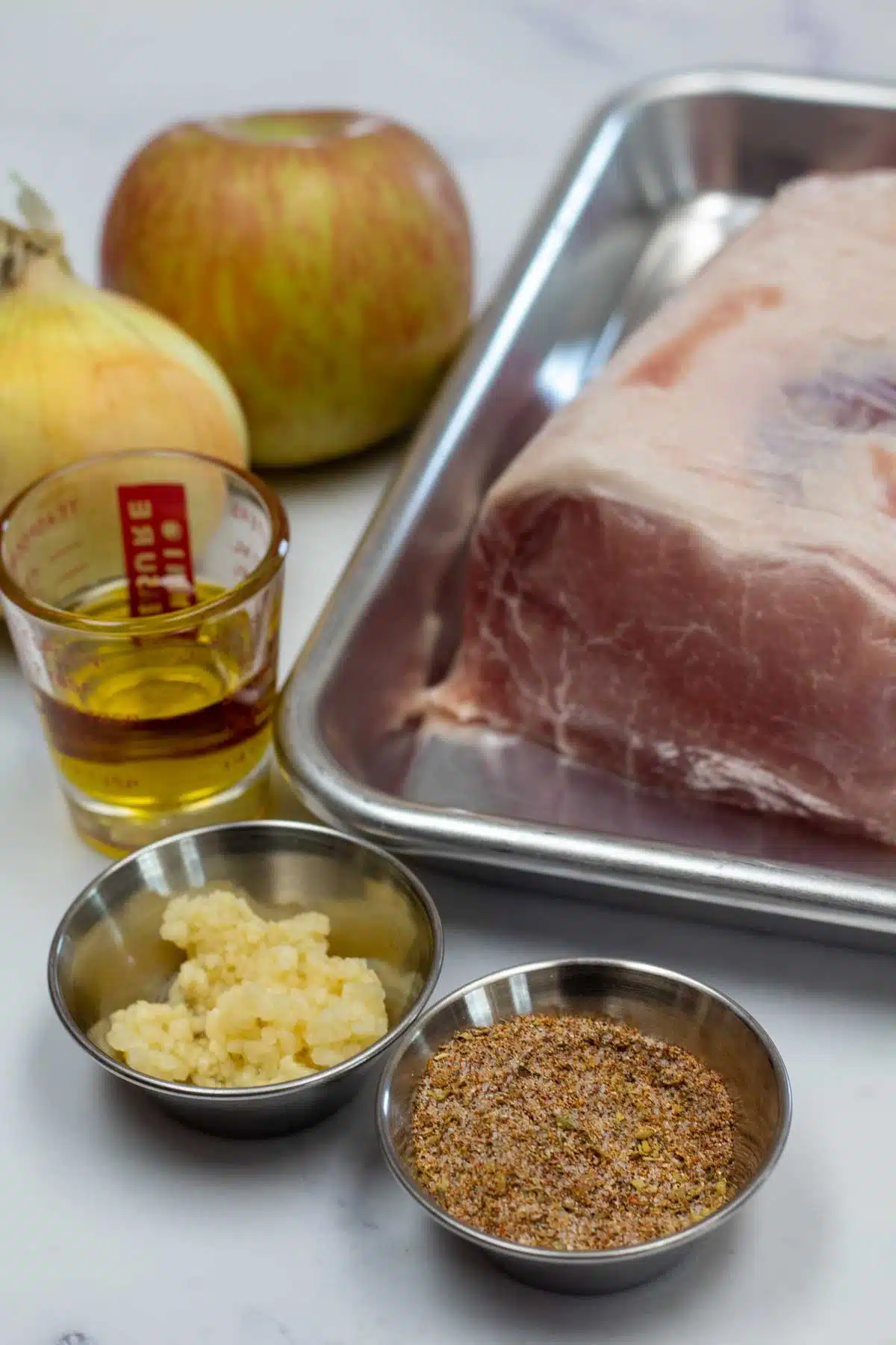Tall image of slow cooker pork ribeye ingredients.