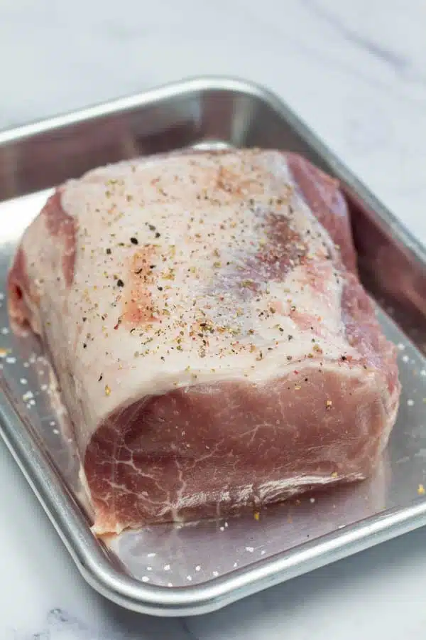 Process image 1 showing pork ribeye roast seasoned.