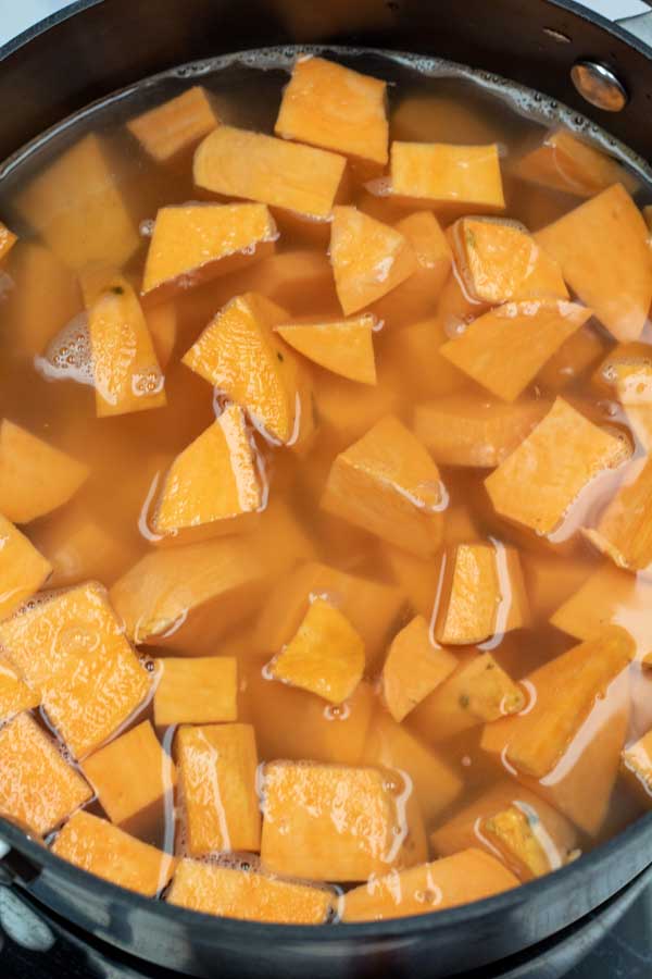 Process image 1 showing cut up sweet potatoes in water.