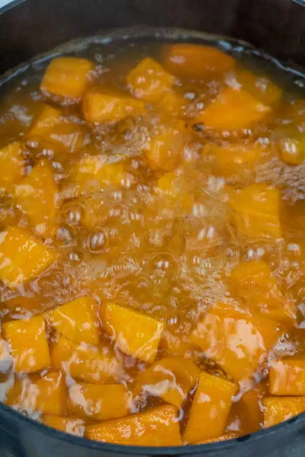 Process image 2 showing cut up sweet potatoes in boiling water.