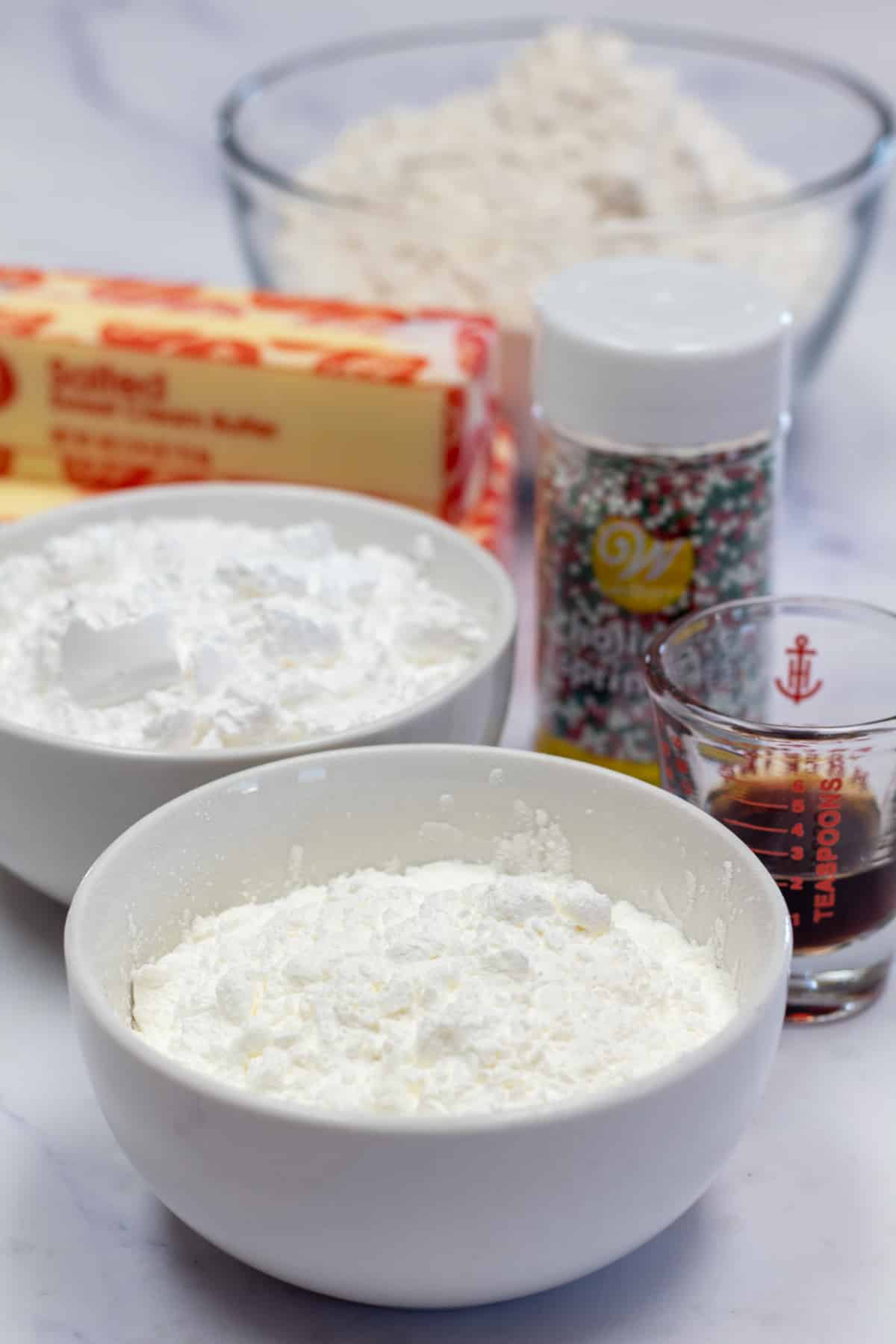 Tall image showing whipped shortbread cookie ingredients.