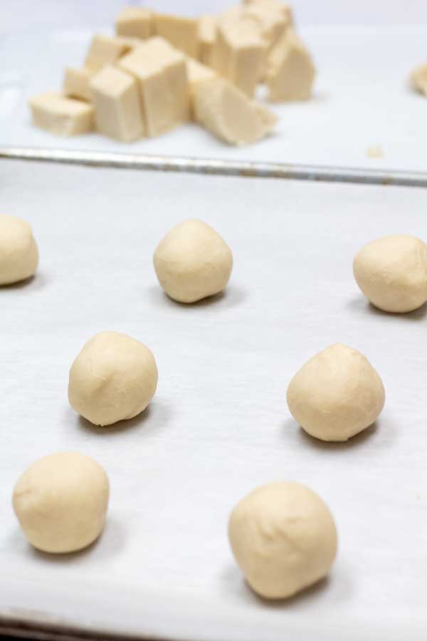Process image 8 showing cookie dough rolled into balls.
