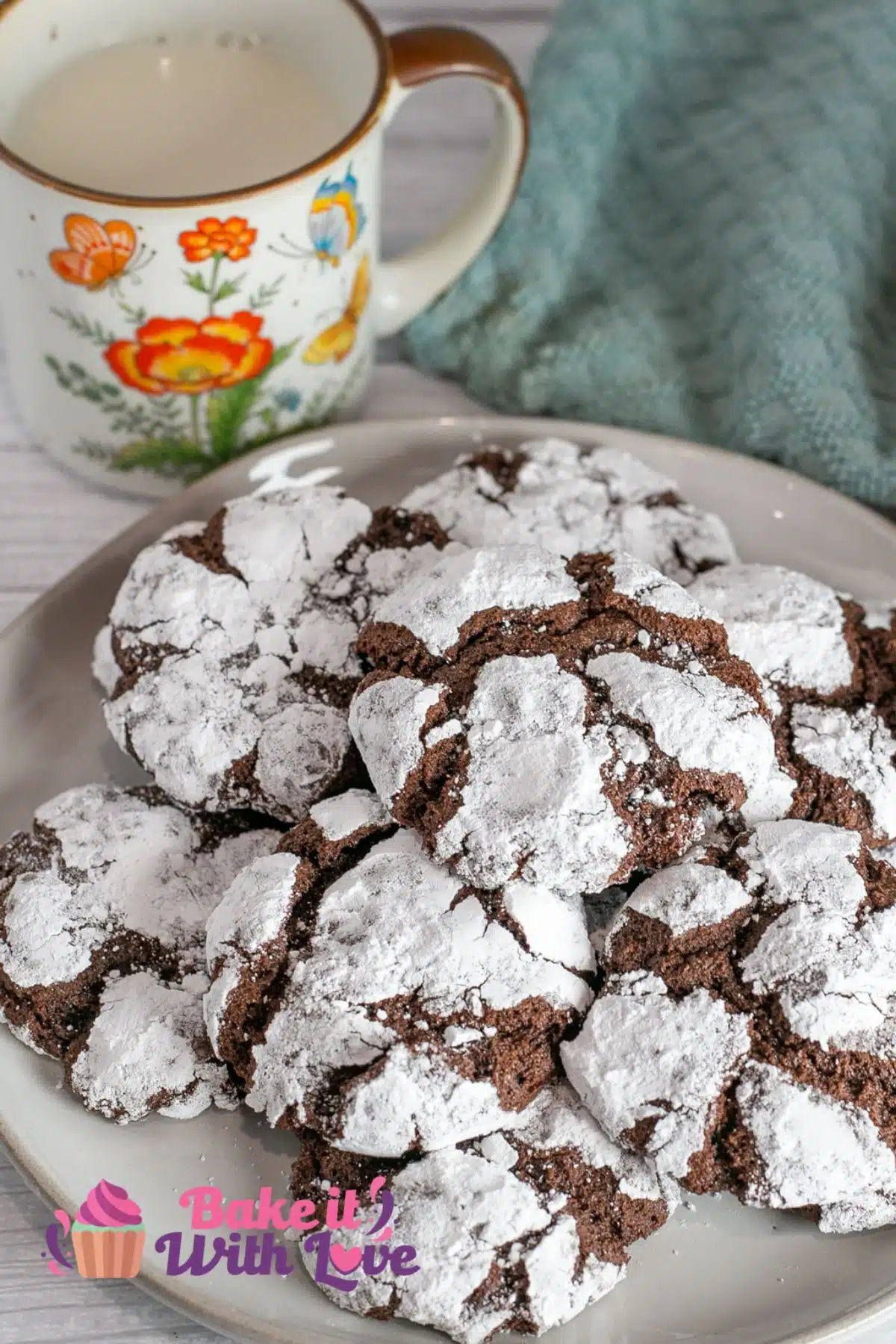 Best chocolate crinkle cookies served on a plate with mug of milk.