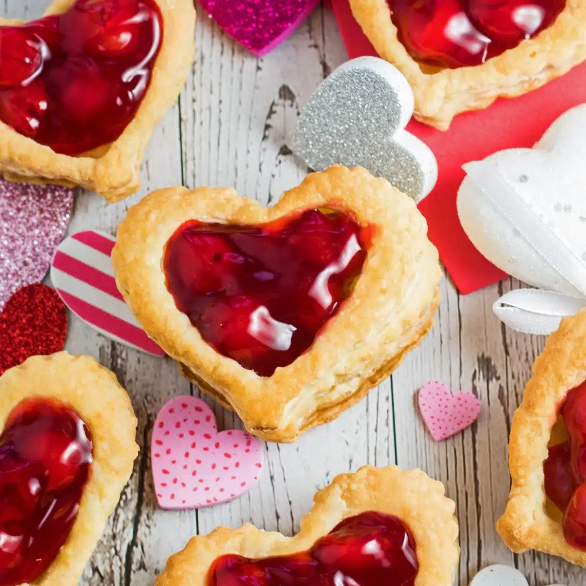 Best heart shaped dessert ideas for Valentine's day in a wonderfully creative collection to impress your loved one like these tasty puff pastry hearts.