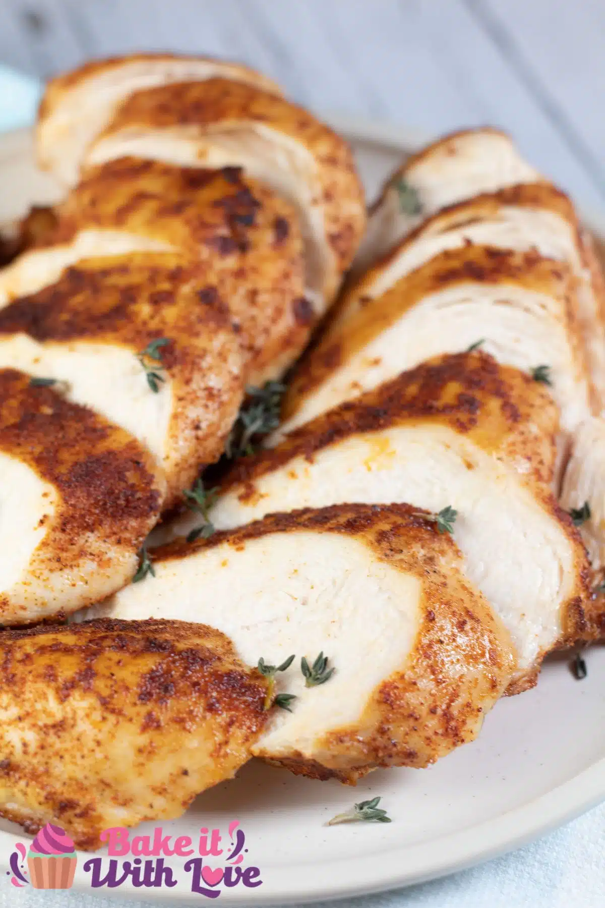 Tall image showing sliced boneless skinless air fryer chicken breasts.
