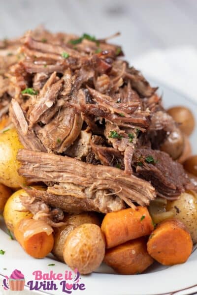 Tall image of braised beef chuck roast.