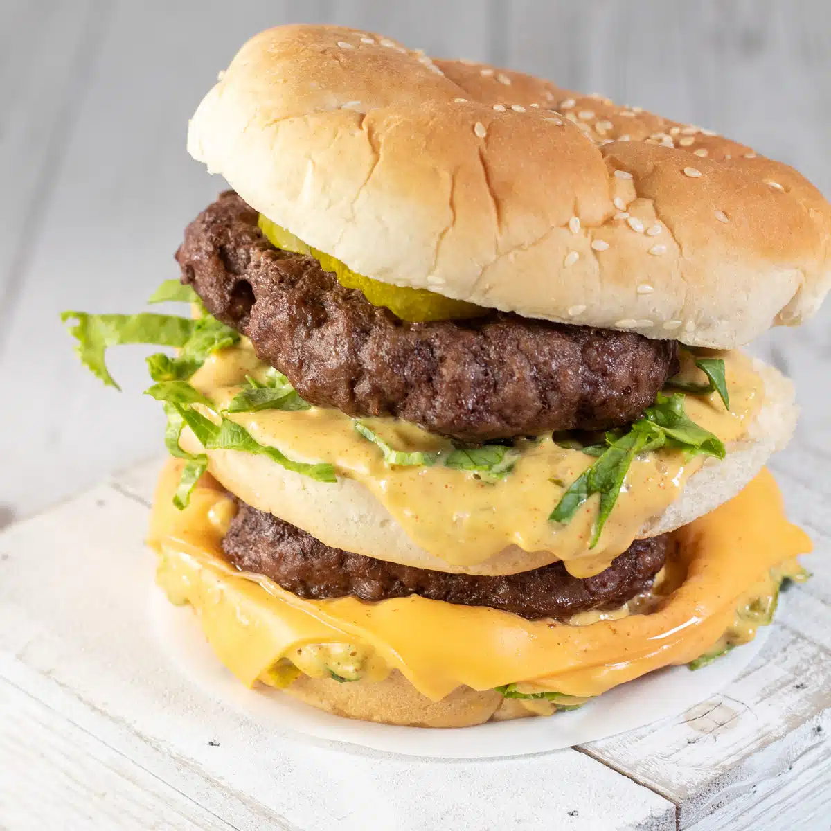 Square image of a homemade Big Mac burger.