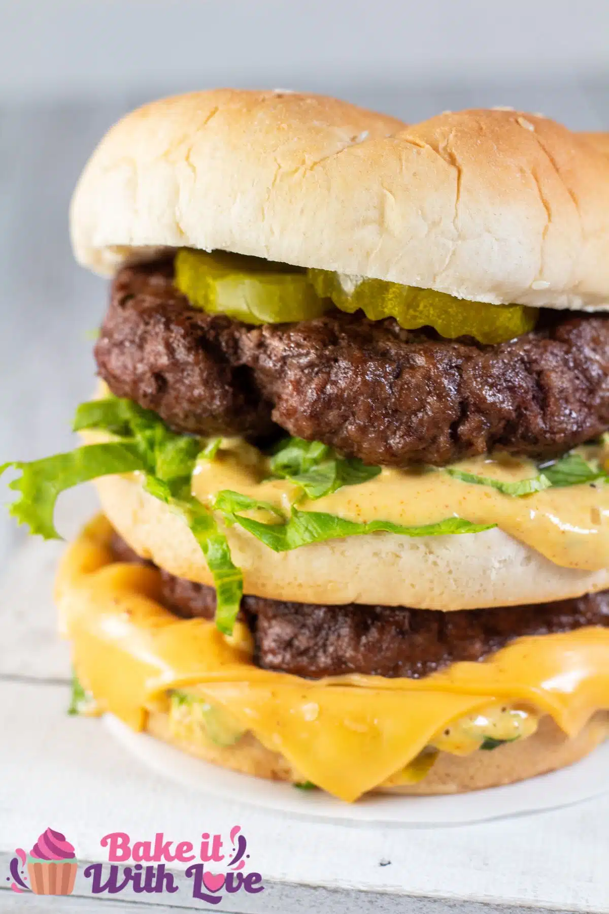 Tall image of a homemade Big Mac burger.
