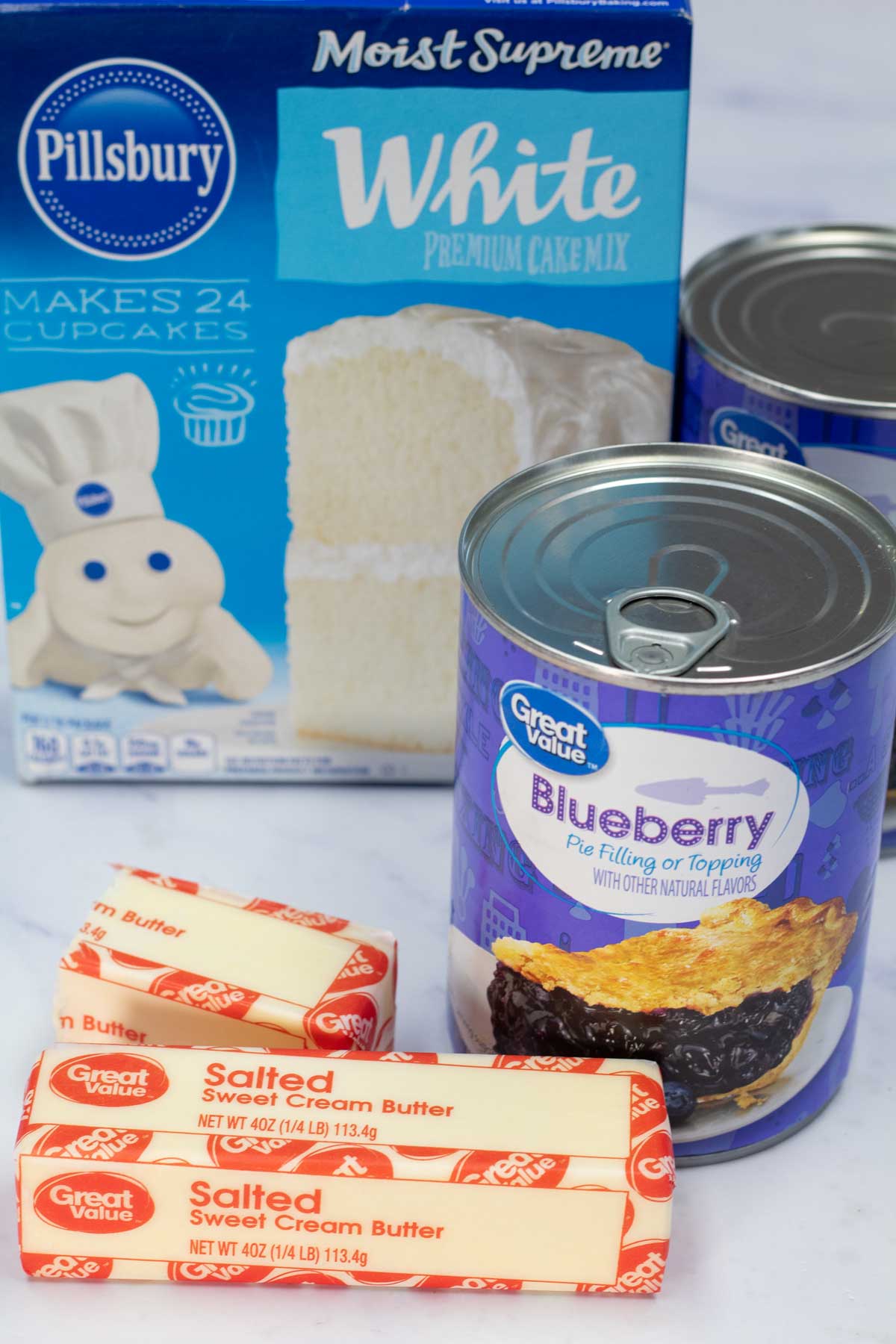 Tall image of blueberry dump cake ingredients.