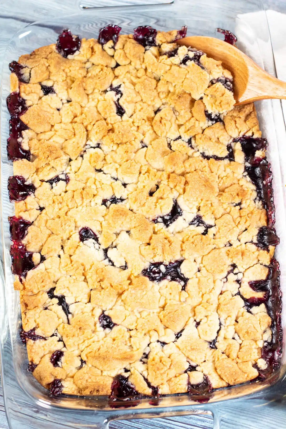 Tall image of blueberry dump cake after baking.