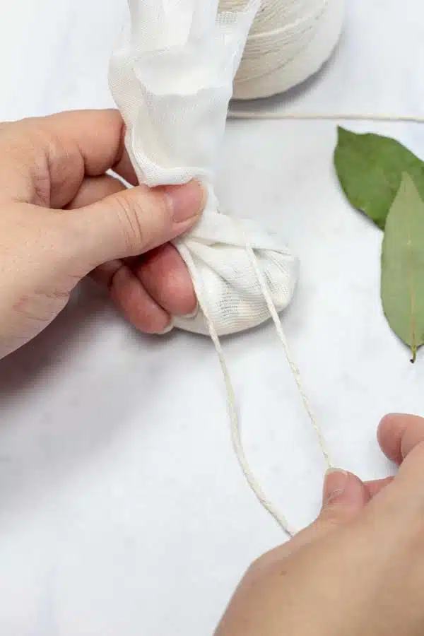 Process 2 image showing tying the bouquet garni.