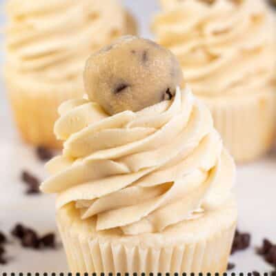 Pin image with text showing a cupcake with cookie dough buttercream frosting.