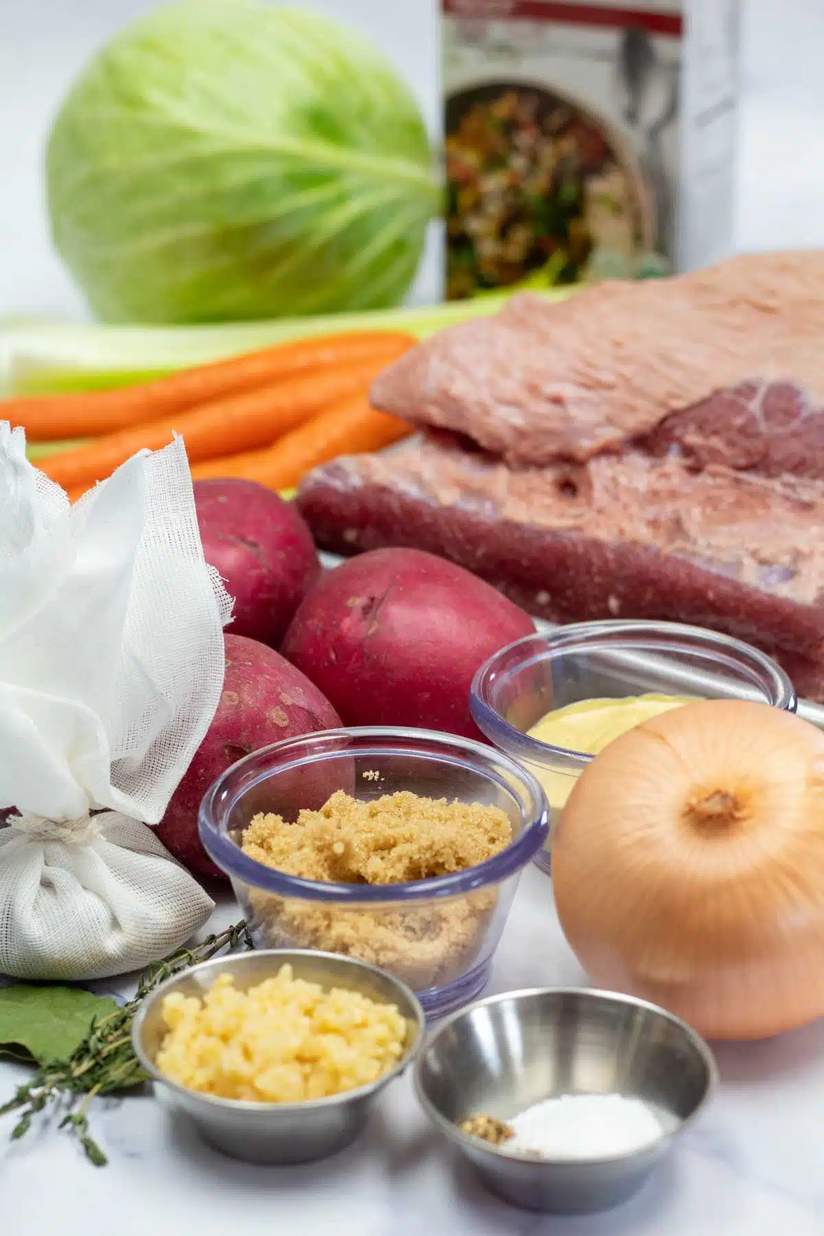 Tall image of ingredients needed for crockpot corned beef.
