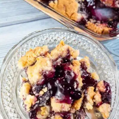 Tall image of blueberry dump cake.