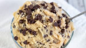 Wide image showing a glass bowl of edible chocolate chip cookie dough.