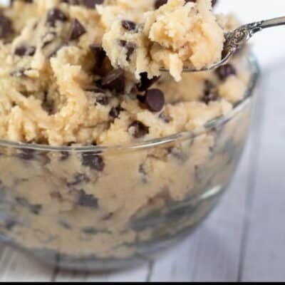 Pin image with text showing a glass bowl of edible chocolate chip cookie dough.