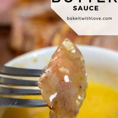 Pin image with text of steak being dipped into garlic butter sauce.