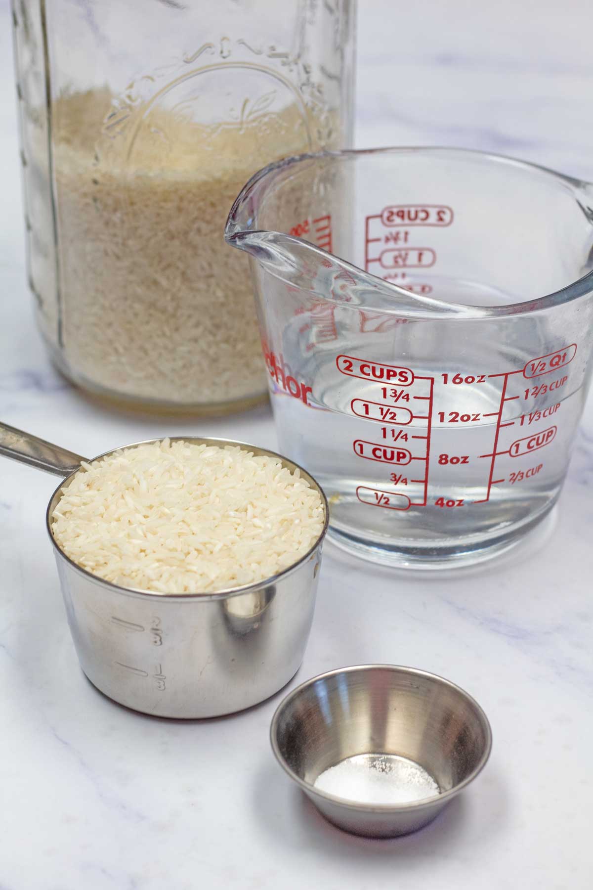 Tall image showing ingredients needed to make instant pot long grain white rice.