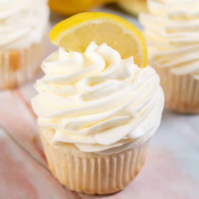 Square image of a cup cake with lemon cream cheese frosting.