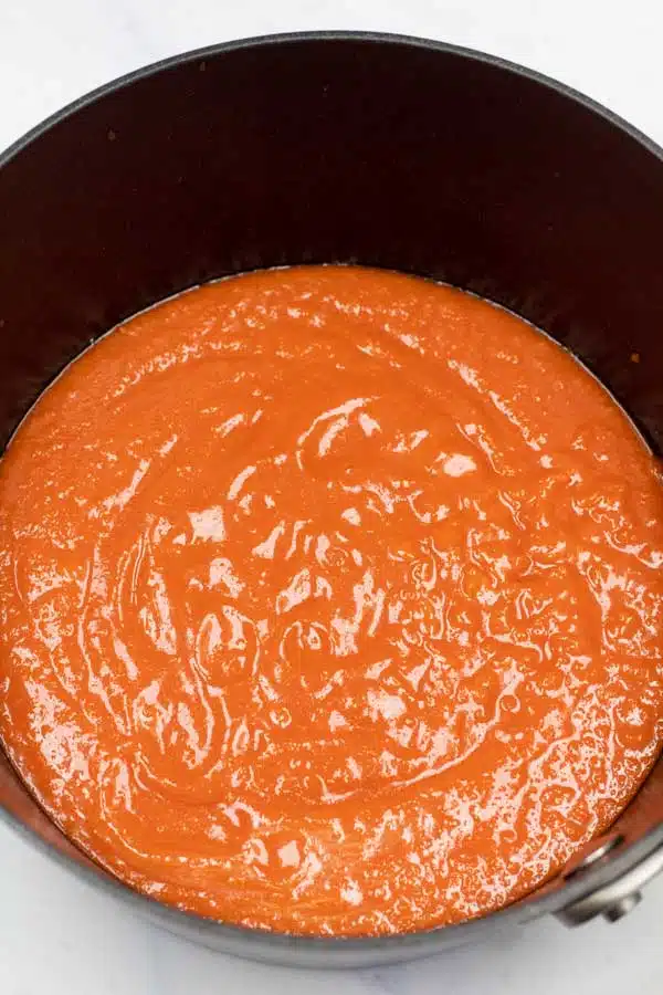 Process image 4 showing sauce in a cooking pan.