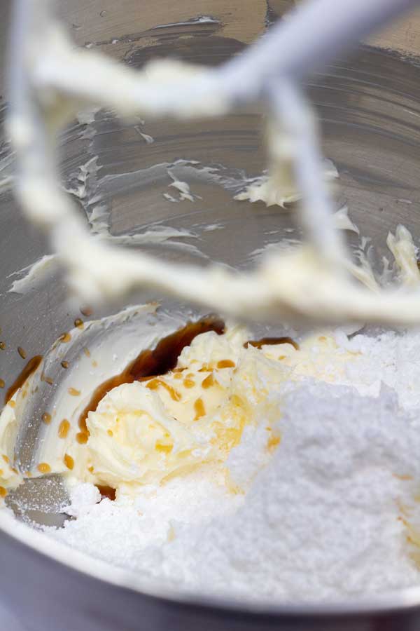 Process image 2 showing added vanilla, powdered sugar, and cream.
