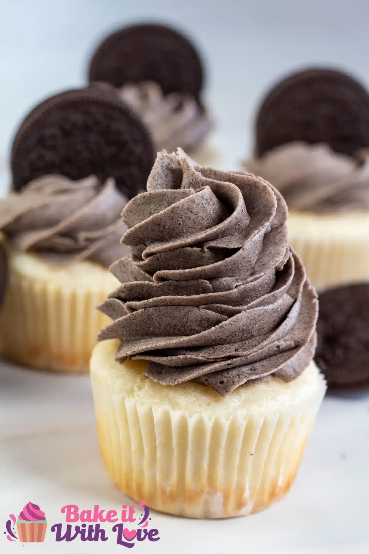 Tall image showing cupcakes with Oreo buttercream frosting.