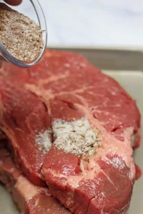 Process image 2 showing adding the steak seasoning.
