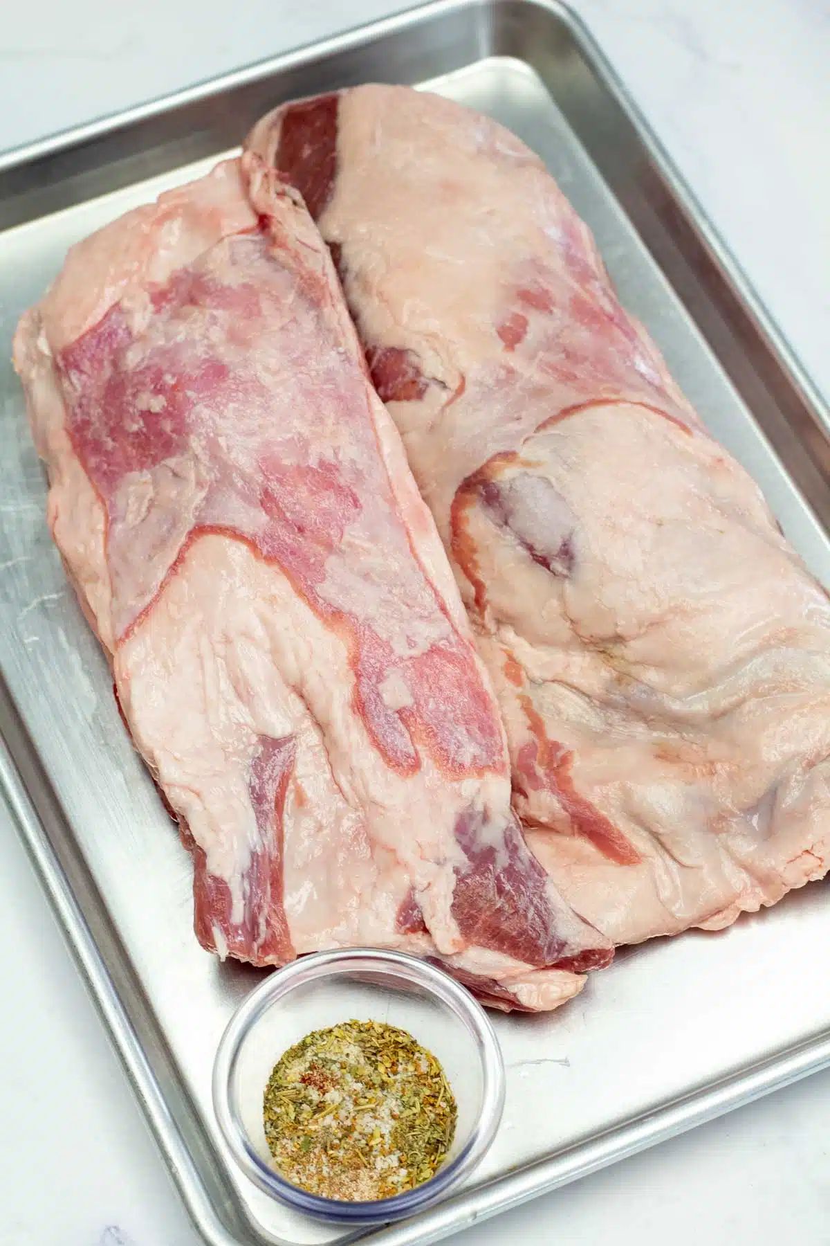Tall image showing roasted lamb breast ingredients.