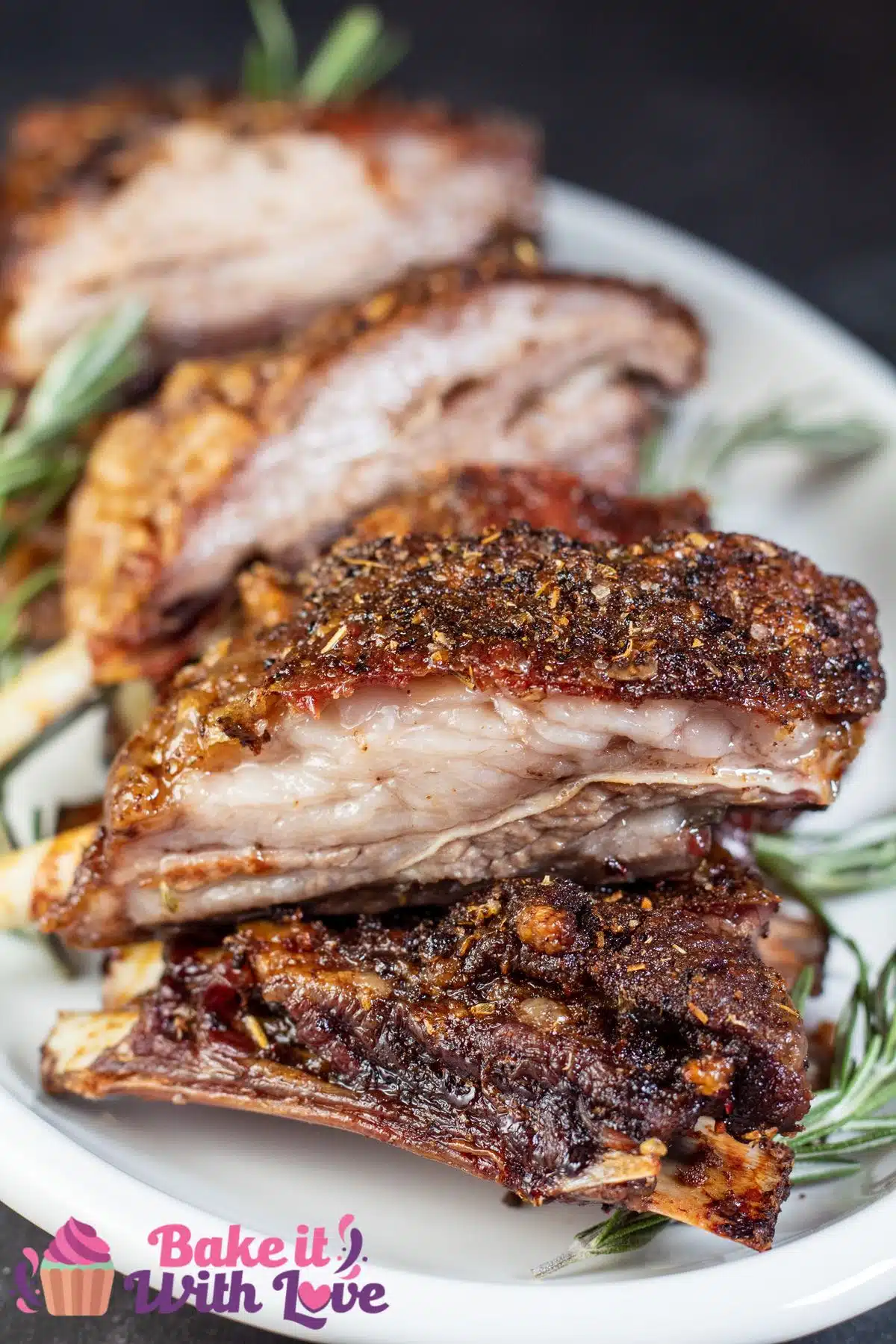 Tall image showing lamb breast ribs on a serving plate.