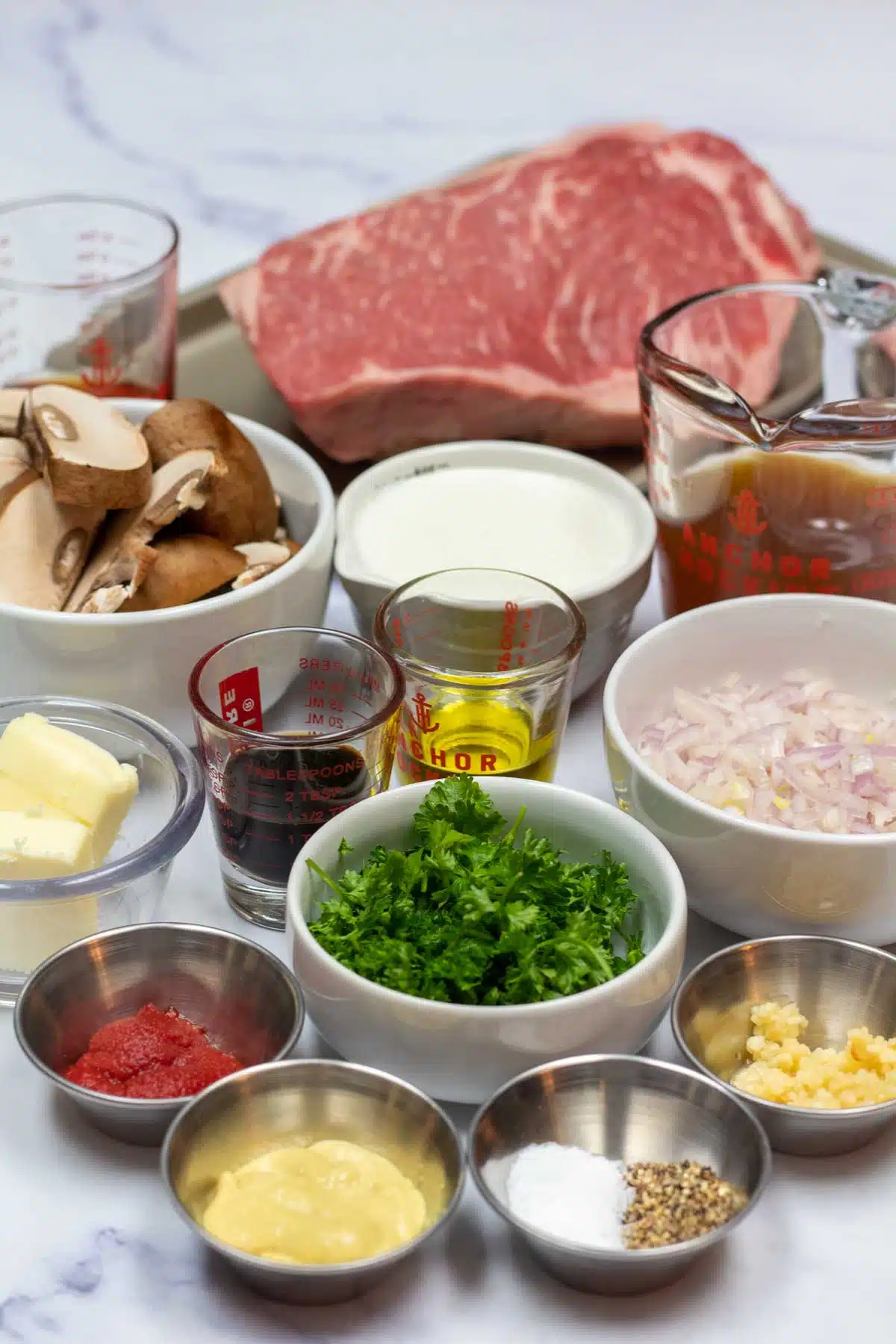 Tall image showing steak Diane ingredients.