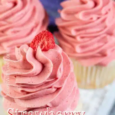 Pin image with text of cupcakes with strawberry cream cheese frosting on top.
