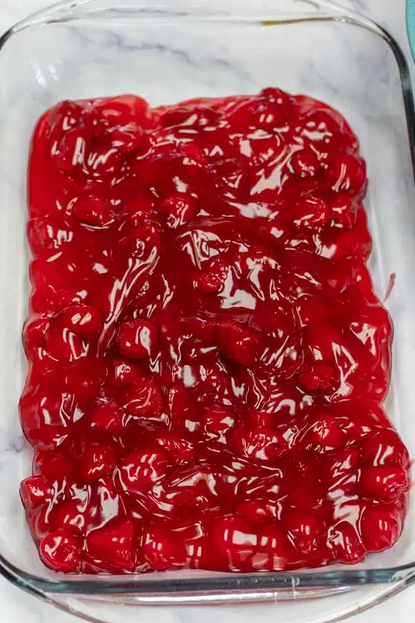 Process image 1 showing canned strawberries in a 9x13 glass dish.