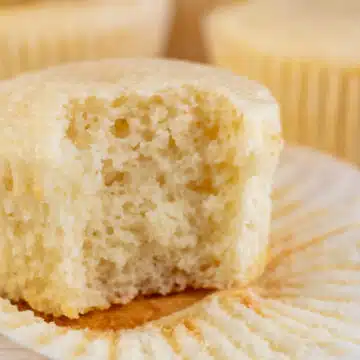 Wide image showing vanilla cupcakes.