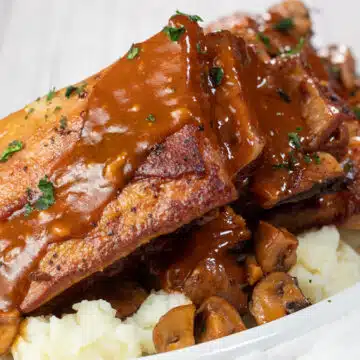 Wide image of braised veal short ribs.