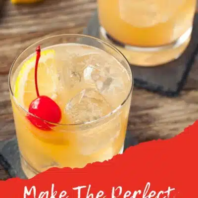 Pin image with text showing a whiskey sour in a tumbler glass with a cherry.