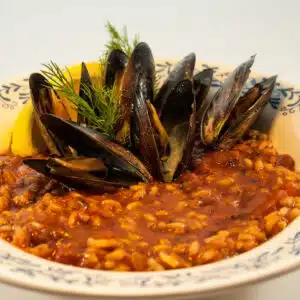 Square image showing chorizo and mussels.