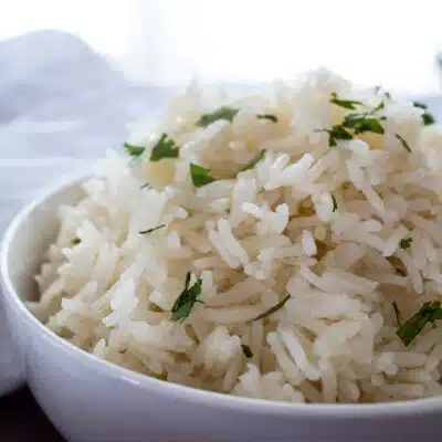 Squaree image of basmati rice in a bowl.