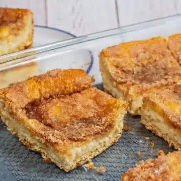 Best sopapilla cheesecake bars recipe baked until tasty and golden perfection, sliced and served in large squares.