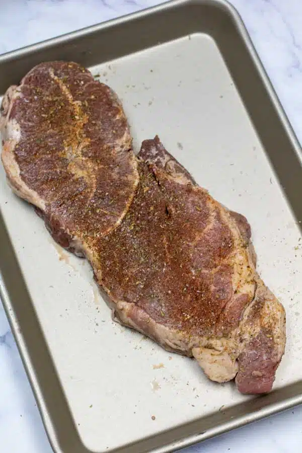 Process image 1 showing seasoned chuck steak.